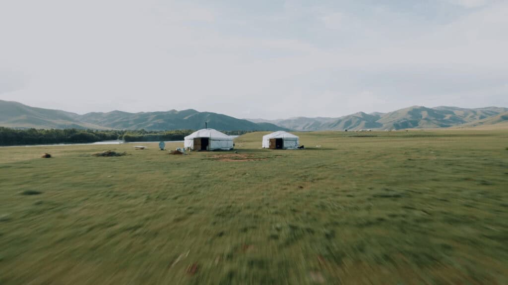 Traditional Mongolian Yurts (Ger) in the green steppes
