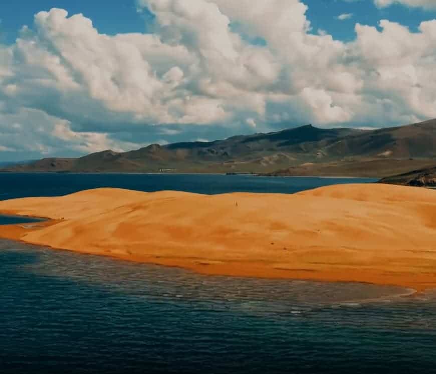 Black Lake Among the Dunes in Mongolia