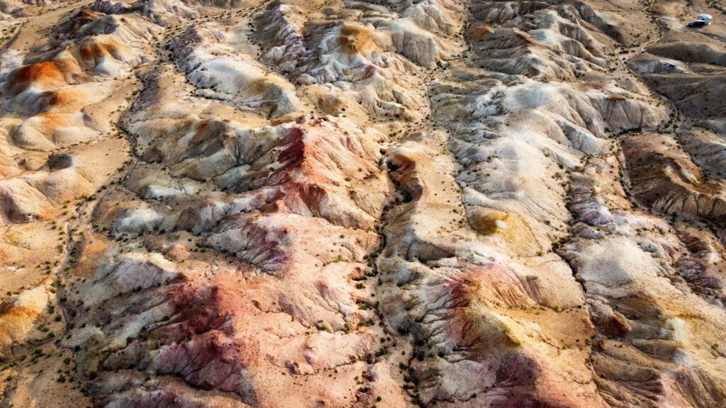 Aerial view of the White Stupa in Mongolia's southern desert. This shows the pink and yellow hues.