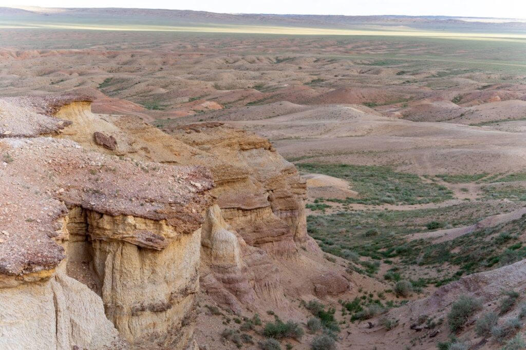 Textured landscape of the pink hills of Mongolia's White Stupa