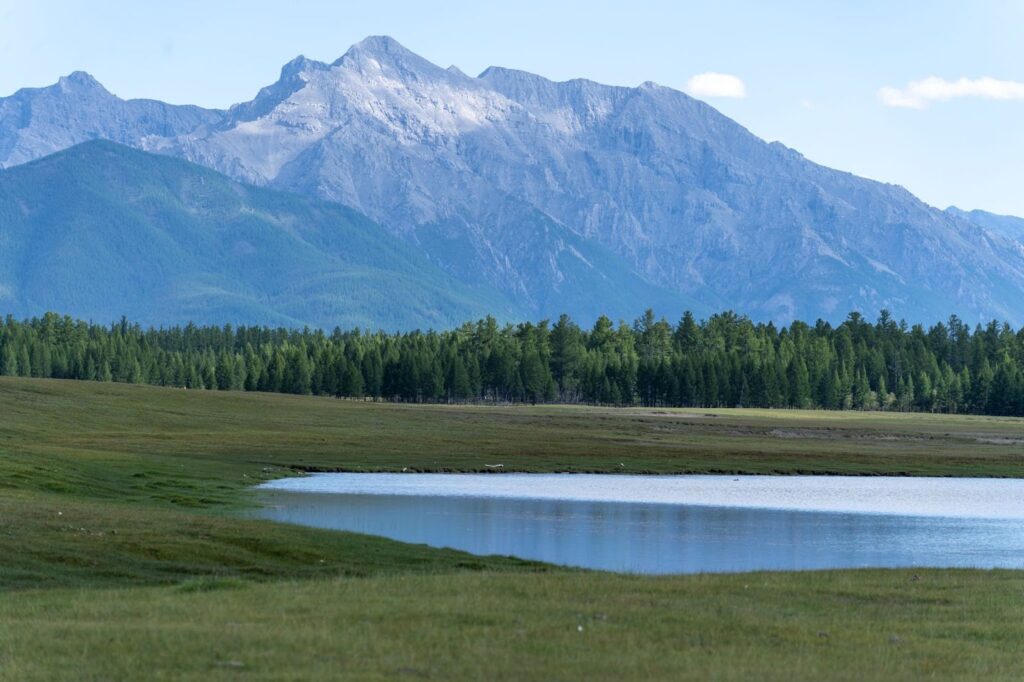 Mountains with a lake in front of it.