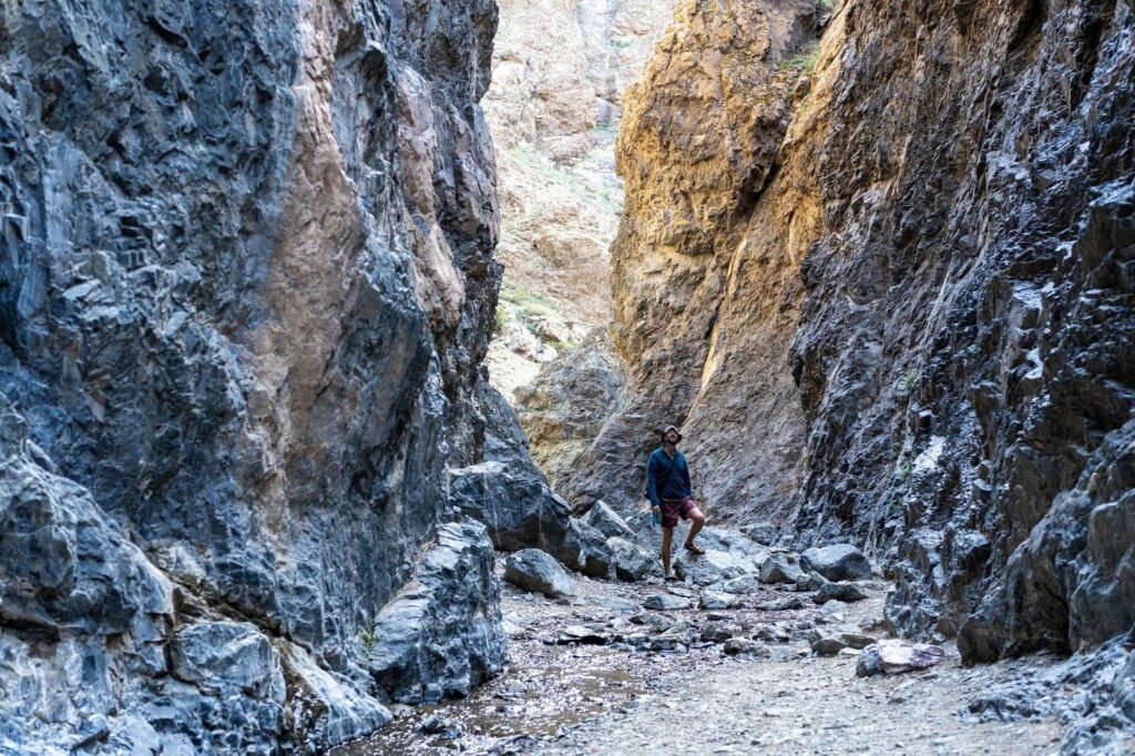Man walking in a Mongolian canyon.