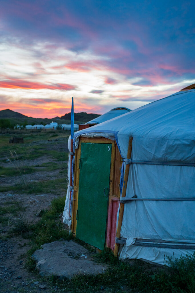 Ger camp with a pink sunset 